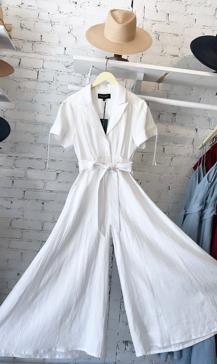 White linen wide leg jumpsuit with lapel and matching fabric belt